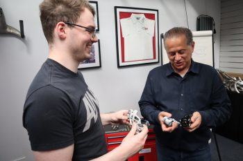 dimitris katsanis and colleague holding 3d printed parts